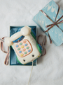 Zabawkowy telefon na kółkach